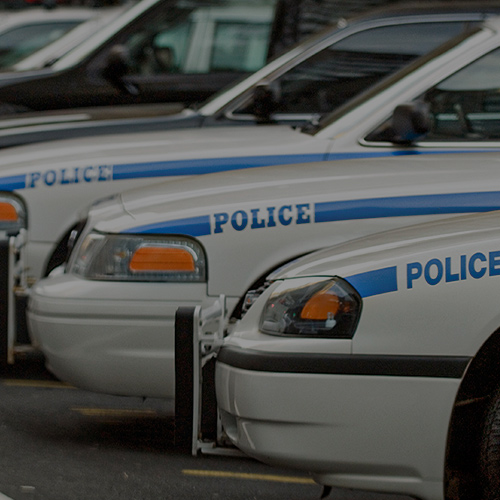 RFQ/Agency: Three police vehicles lined up in formation. 